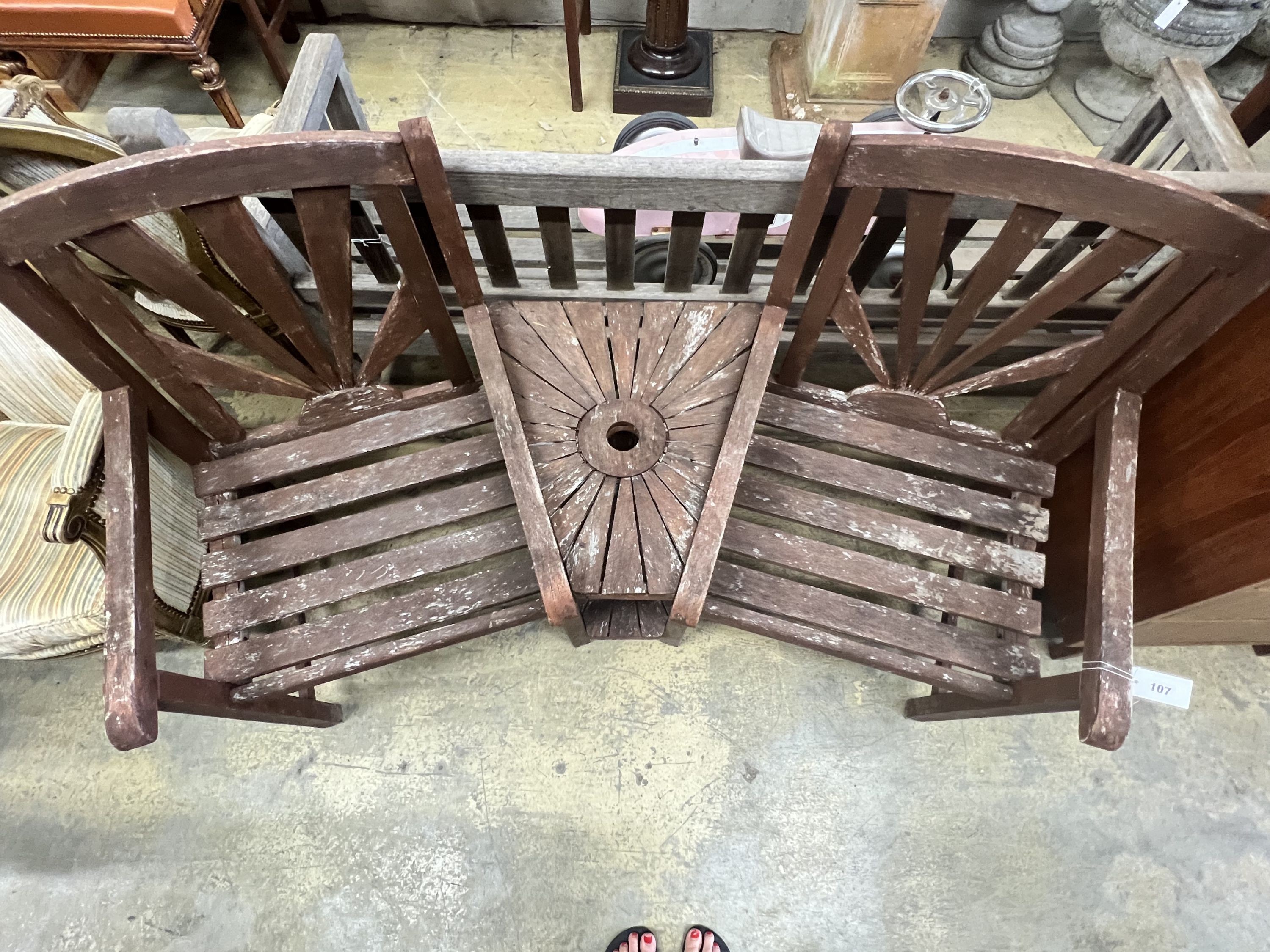 A stained teak duet garden bench, 156 x 54cm height 94cm